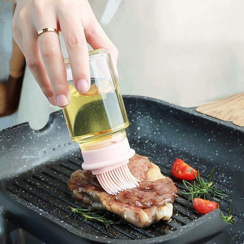 Using oil dispenser brush bottle on grilled steak in pan